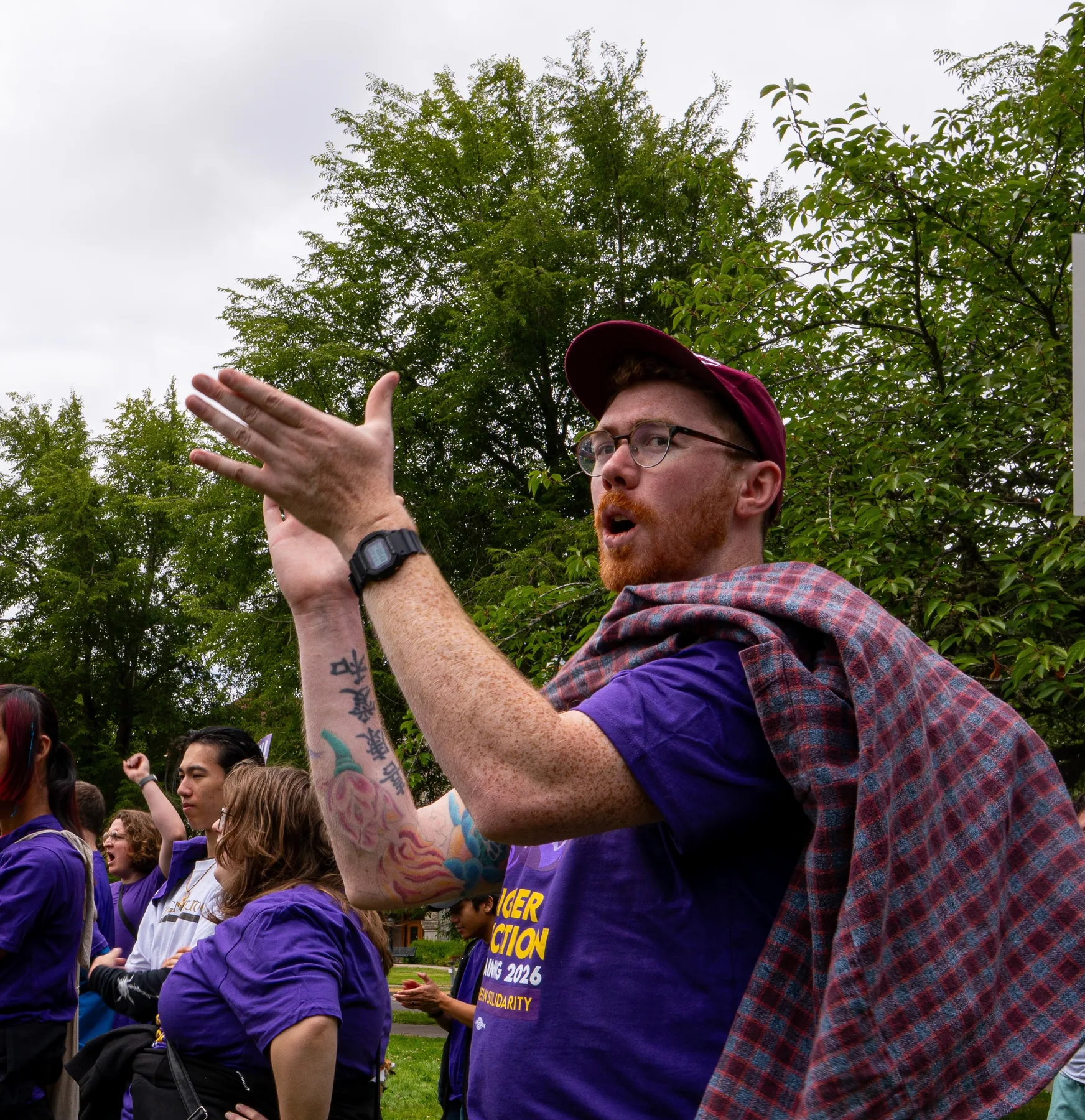 A Local 083 member claps and chants with coworkers during the June 30 rally
