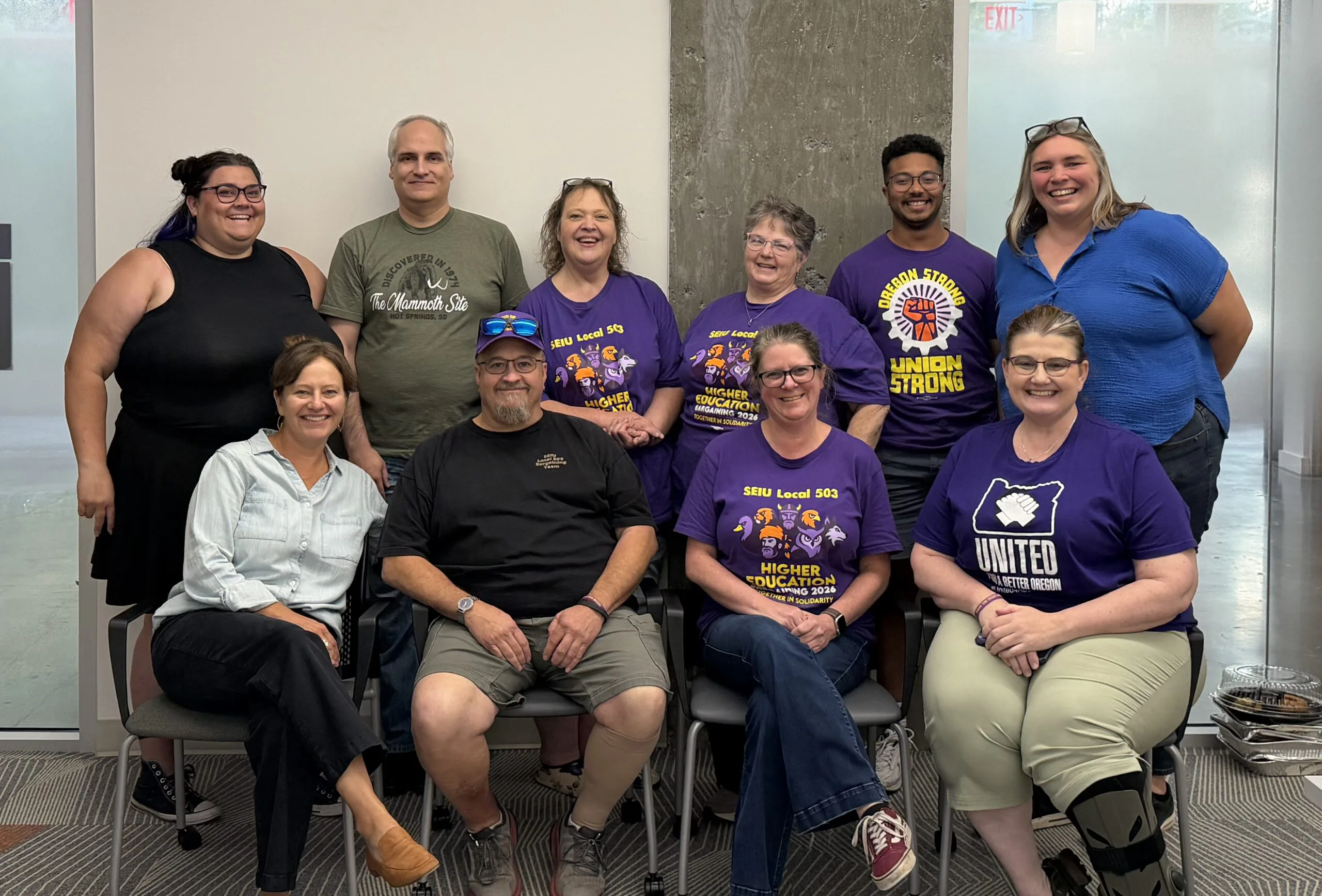 SEIU Local 503 Higher Education bargaining team members meet around tables during August mediation.