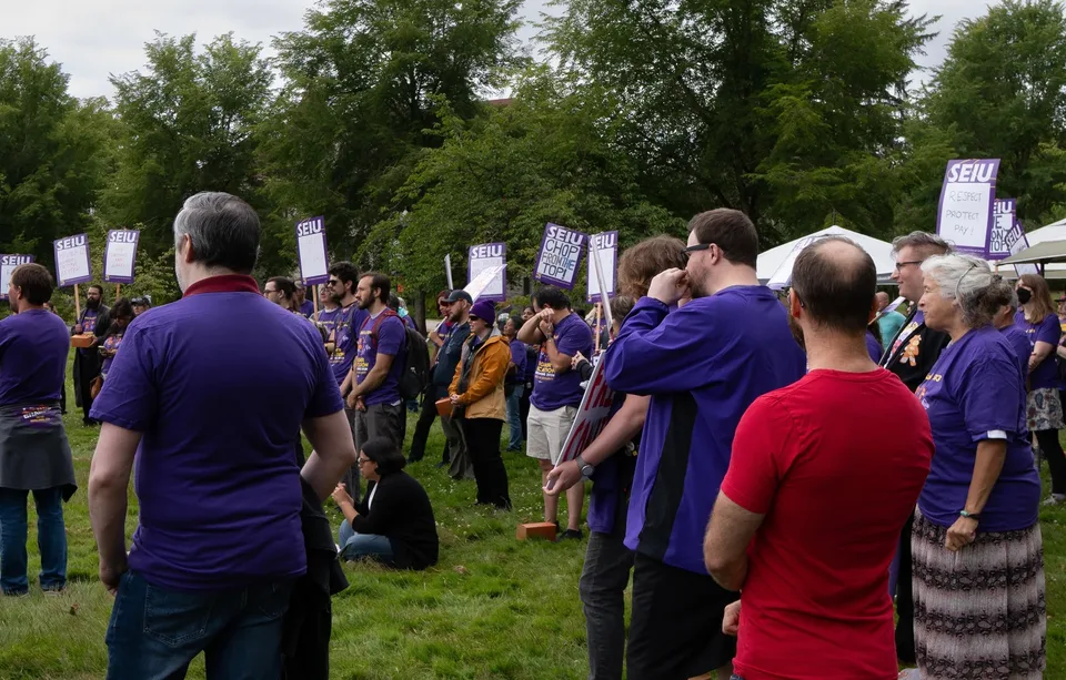 Local 083 members and supporters gather with SEIU signs at McNary Field
