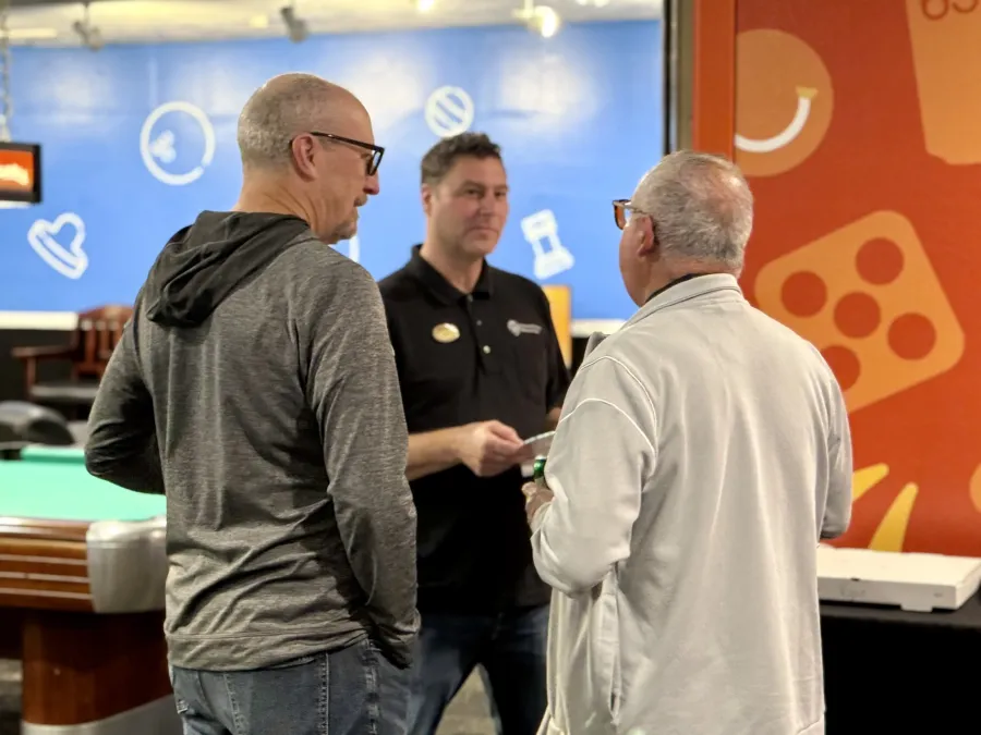 Local 083 members in conversation at a community event